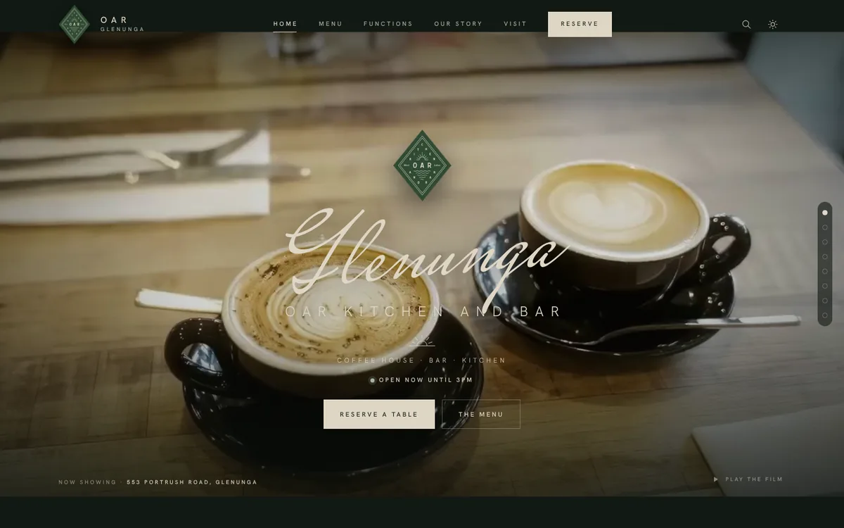 The Oar Glenunga home page: a still from the cafe's own film of two coffees on a timber table, with the Oar logo, Glenunga written in script and a live Open now until 3pm status